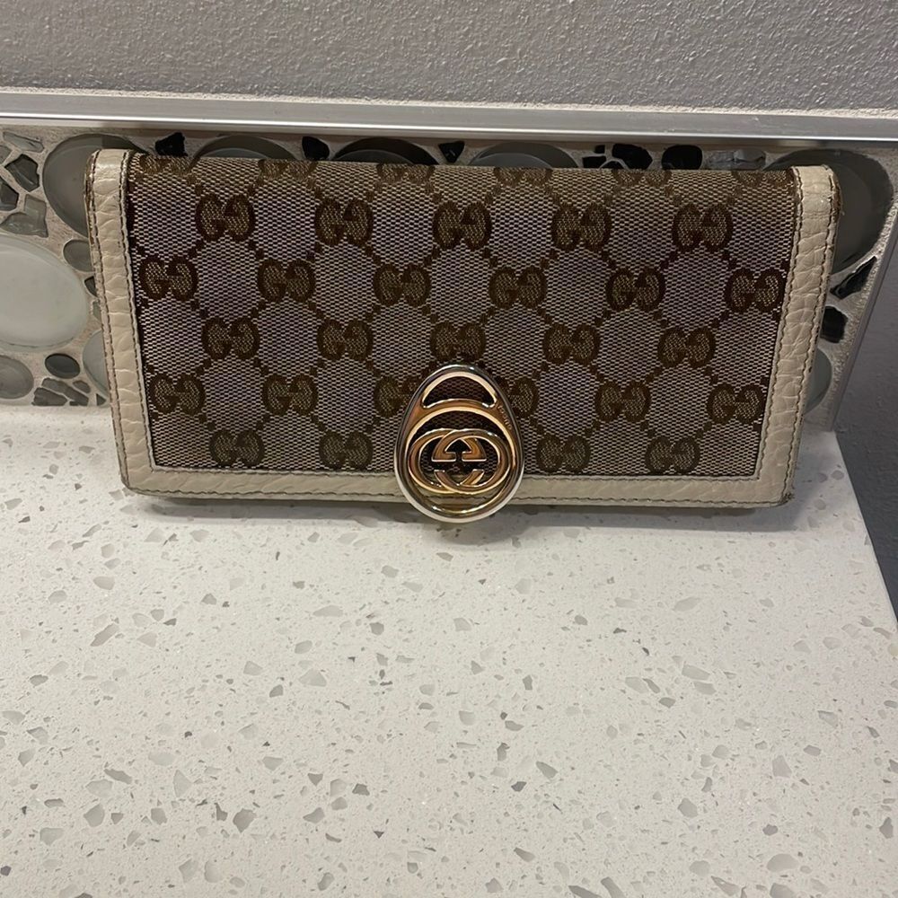 Gucci woman’s canvas and cream leather wallet